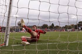 Matt Butcher clears Ronan Curtis' goalbound shot on Saturday. (Photo by Daniel Chesterton/PinPep)