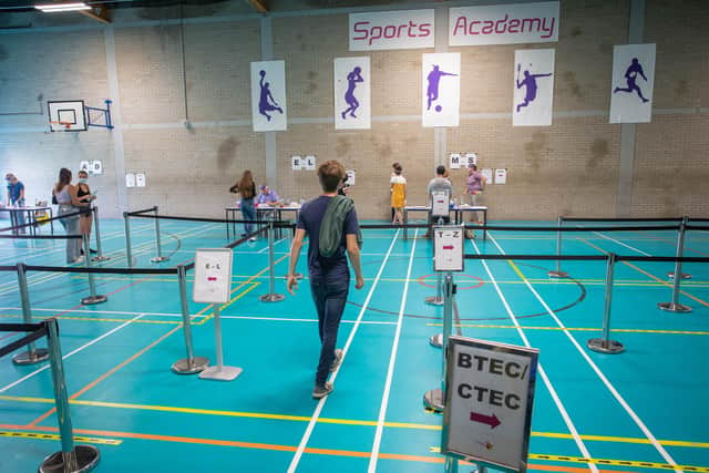 Social distancing measures put in place in the the sports hall at Portsmouth College where students collect their results.

Picture: Habibur Rahman