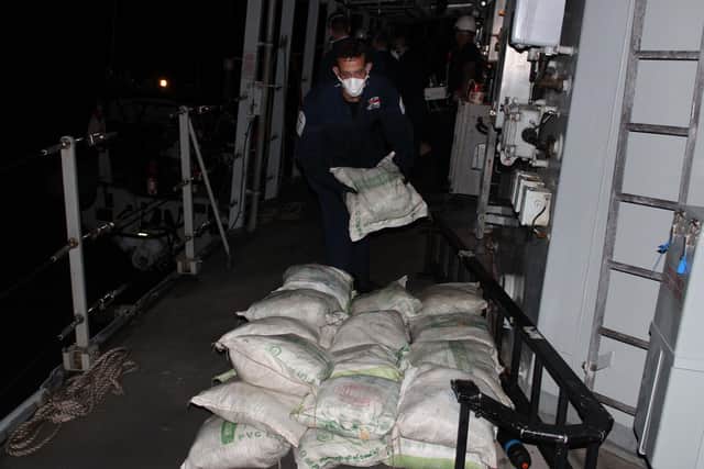 The drugs are piled aboard HMS Lancaster in the dead of night:The drugs are piled aboard HMS Lancaster in the dead of night (May 9). Picture: Royal Navy.