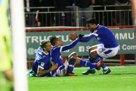 Danny Rose celebrates with goalscorer Kyle Bennett at Crawley in March 2017 - after the winger put Pompey on their way to the League Two title. Picture: Joe Pepler/Digital South