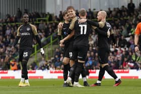 Sean Raggett celebrates with his team-mates after netting his Pompey winner against Forest Green Rovers on Saturday. Picture: Jason Brown/ProSportsImages