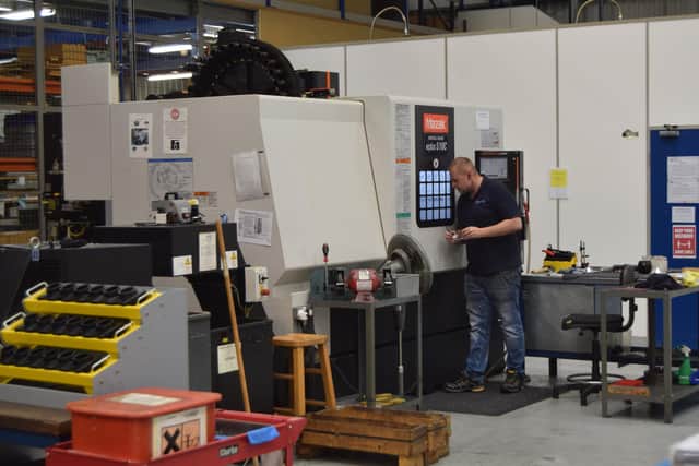 Pictured is a staff member working on one the factory's production line. Photo: Tom Cotterill