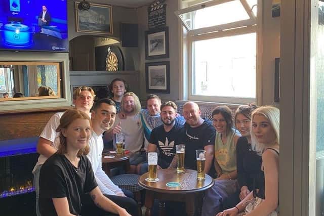 Punters at Duke of Devonshire on Albert Road, Southsea, celebrate pub keeping its licence on August 21, 2021. Pic: Tom Yaman.