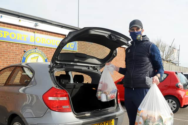Matt Paterson loads food parcels into his car as part of Gosport Borough's 'Feed a Family in Need' scheme. Picture: Sarah Standing