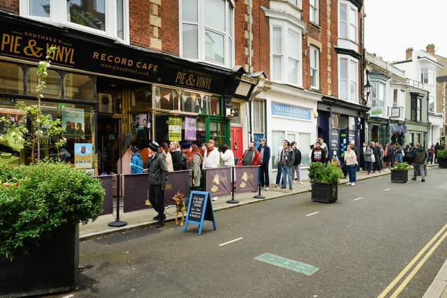 Pictured is: Customers queue to get their records. Picture: Keith Woodland (220421-1)
