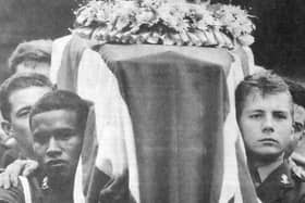 Pallbearers from the Royal Artillery carry Stephen’s coffin in the crematorium.