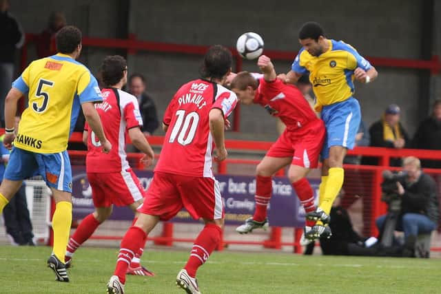 Ian Simpemba heads the first of his two goals in Hawks' 3-0 win at his former club Crawley Town. Pic: Dave Haines.