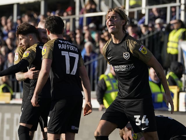 Pompey defender Ryley Towler attempts to orchestrated the 1,275 Pompey fans who travelled to Bristol Rovers on Saturday.
