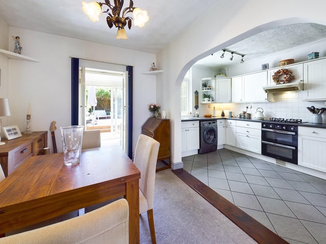 The open-plan living area with the kitchen