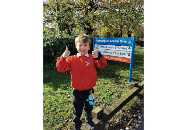 Shay Glenton, 8 from Lee-on-the-Solent, will be cycling for two hours straight to raise money for University Hospital Southampton which has cared for him since his diagnosis of epilepsy and subsequent brain surgery. Pictured: Shay outside the hospital