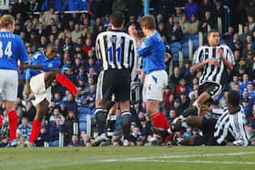 Pompey's Lomana LuaLua, left, fires home against parent club Newcastle at Fratton Park in February 2004. Picture: Mike Hewitt/Getty Images