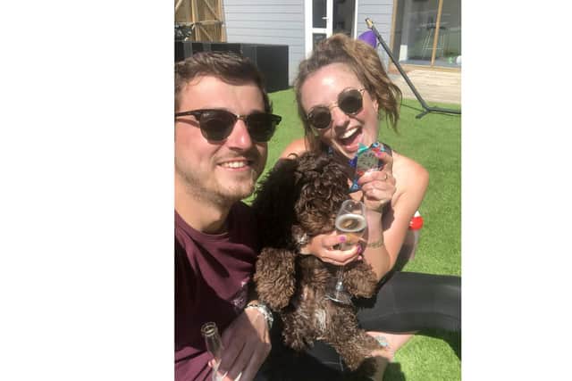 With the London Marathon postponed, Alice Jefferies ran 26.2 miles on her treadmill for the Stroke Association. Pictured with her boyfriend Ryan Blackburn and Colin the dog.