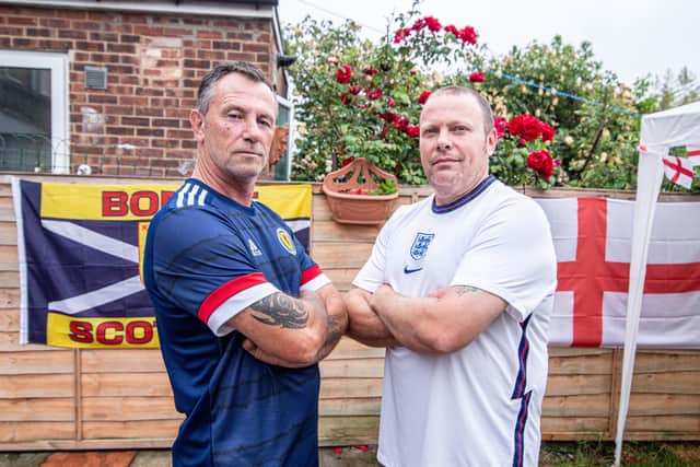 Darren Archer and his father in law, Cliff Williams will be on opposite side of the fence during England and Scotland's clash at the Euros tomorrow.Pictured: Cliff Williams and Darren Archer at Darrens Home in Milton, Portsmouth on 17 June 2021Picture: Habibur Rahman