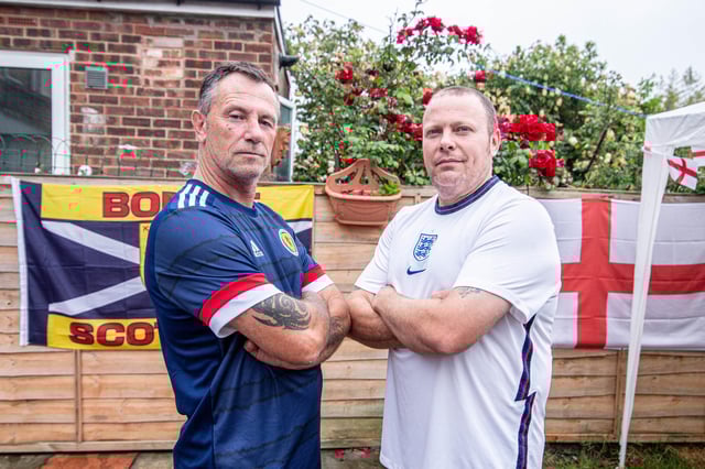 Darren Archer and his father in law, Cliff Williams will be on opposite side of the fence during England and Scotland's clash at the Euros tomorrow.
Pictured: Cliff Williams and Darren Archer at Darrens Home in Milton, Portsmouth on 17 June 2021
Picture: Habibur Rahman