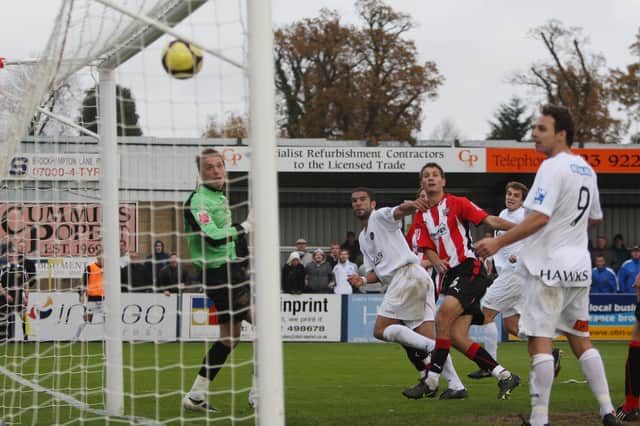 Ian Simpemba (second left) scores for Hawks in their 3-1 FA Cup loss to Brentford in 2008/09. Picture by Dave Haines.