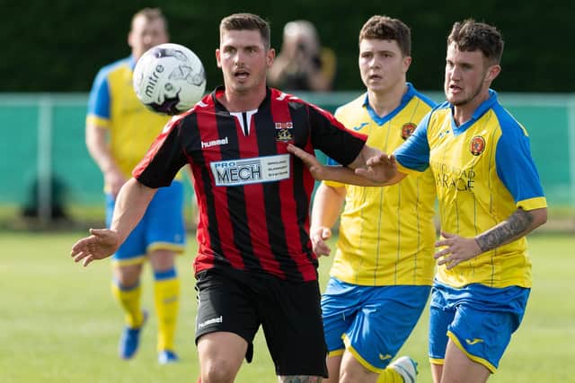 Garry Moody, left, was sent off in Fareham Town's FA Vase defeat at Plymouth Parkway. Picture: Keith Woodland