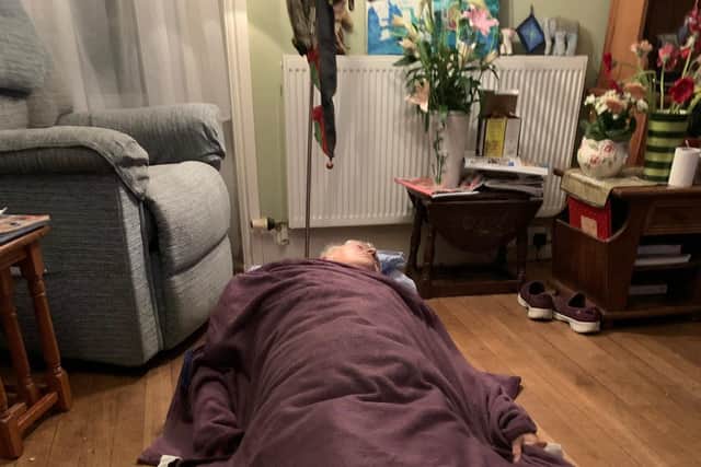 Eileen Webb, 83, on the floor of her home where she fell on Thursday, October 21 2021 and waited from 5.20pm until 9pm for an ambulance to arrive amid a surge in demand at Queen Alexandra Hospital in Cosham.