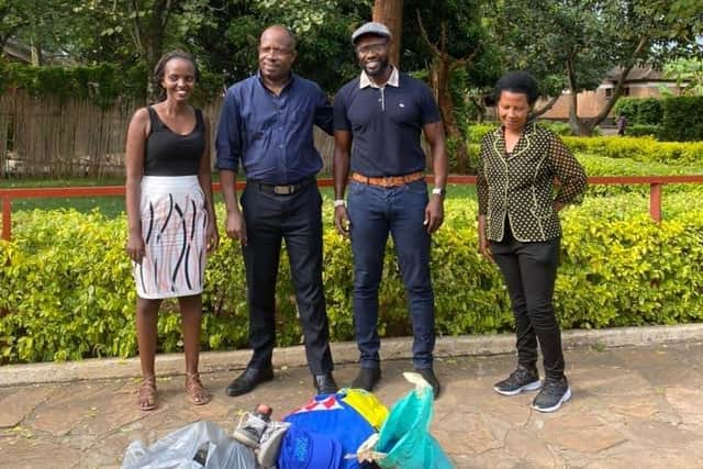 Warren, third from left, as SOS Orphanage with secretary Aline Kwizera, who was raised in that same centre, the director Damian Pasquet Barindogo and house keeper Bernadette Nikundana