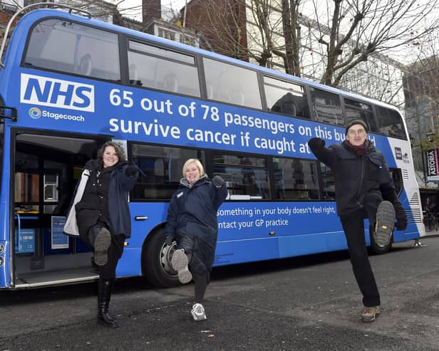 The NHS ’Bus-ting Cancer Tour’ in Guildhall Walk, Portsmouth on Friday, December 1, 2023, for the first time. 
Pictured is: (l-r) Danielle Robertson, Rachel Hibbert and Dr Richard Roope.
Picture: Sarah Standing (011223-2826)
