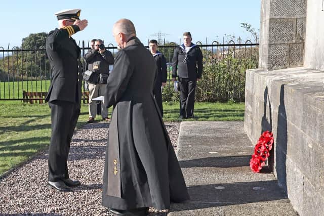 Commander Terry Tyack Royal Navy, Executive Officer, HMS Collingwood laying a wreath near the monument
Picture: Barry Zee
