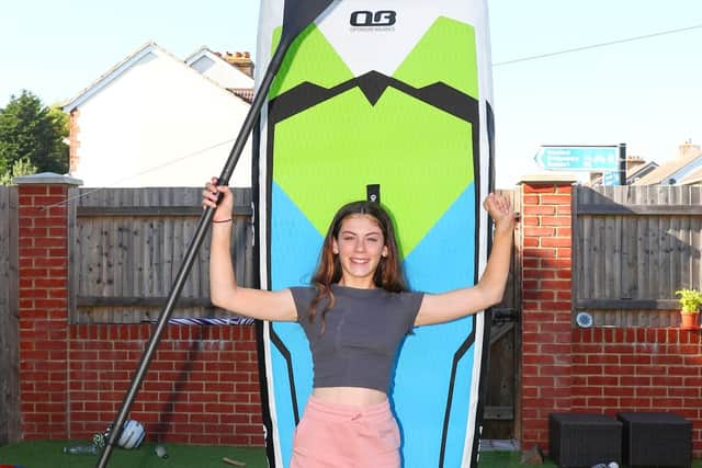 Seren with her a paddleboard ahead of the challenge. Picture: Stuart Martin (220421-7042)
