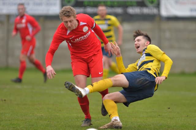 Horndean skipper Ash Howes (red) v Hamworthy. Picture: Martyn White