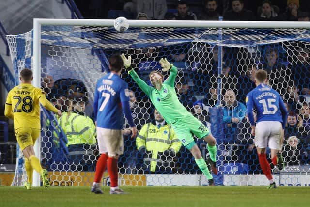 Alex Bass watches Glenn Whelan's free-kick smack the upright on the stroke of half-time. Picture: Joe Pepler