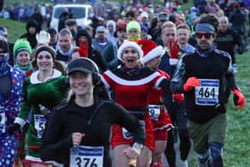Runners donned festive attire for the Portsmouth Coastal Waterside Marathon. Picture: Chris  Moorhouse (221224-05)