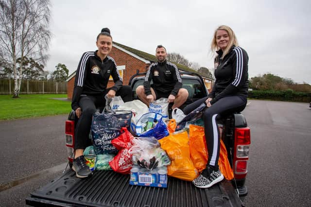 Liam Walsh and his fitness group coaches, Jade Bradley and Becki Gill on his pick-up truck at Catisfield Hall, Fareham.

Picture: Habibur Rahman