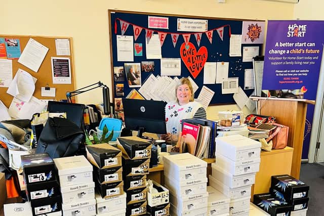 Jo Toms, chief operating offier of Home-Start Portsmouth, with some of the shoe donations. 