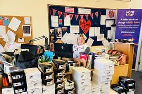 Jo Toms, chief operating offier of Home-Start Portsmouth, with some of the shoe donations. 