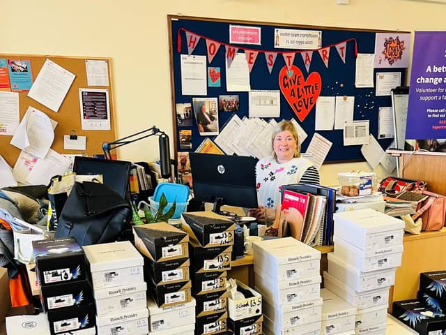 Jo Toms, chief operating offier of Home-Start Portsmouth, with some of the shoe donations. 