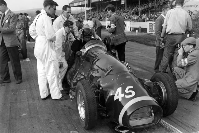 British racing driver Tony Rolt (1918 - 2008) in a Connaught before the Chichester Cup race at the Goodwood Circuit, West Sussex, 19th April 1954. (Photo by Les Lee/Central Press/Hulton Archive/Getty Images)