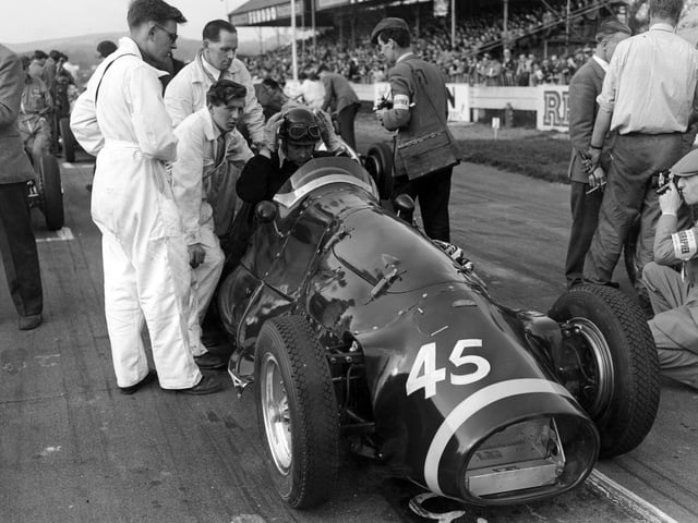 British racing driver Tony Rolt (1918 - 2008) in a Connaught before the Chichester Cup race at the Goodwood Circuit, West Sussex, 19th April 1954. (Photo by Les Lee/Central Press/Hulton Archive/Getty Images)