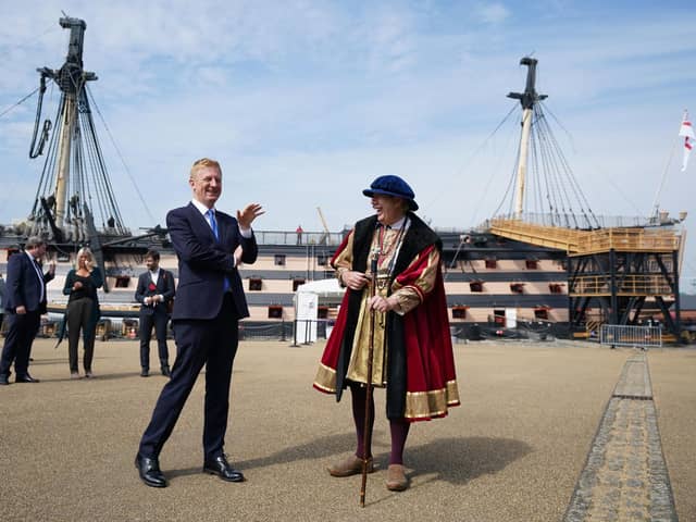 Culture secretary Oliver Dowden, left, chats with an historical interpreter during a visit to Portsmouth Historic Dockyard to announce how the final £300 million of the Culture Recovery Fund will be spent. Picture: Andrew Matthews/PA Wire