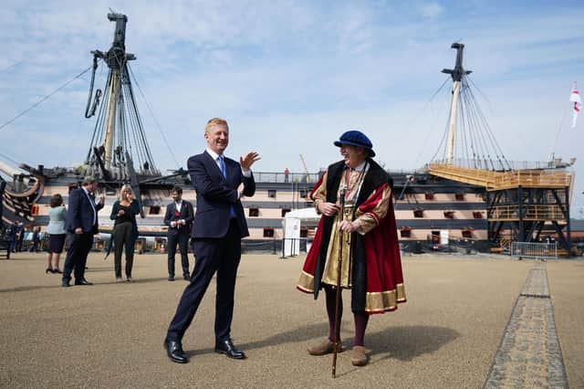 Culture secretary Oliver Dowden, left, chats with an historical interpreter during a visit to Portsmouth Historic Dockyard to announce how the final £300 million of the Culture Recovery Fund will be spent. Picture: Andrew Matthews/PA Wire