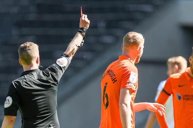Portsmouth FC defender Jack Whatmough (6)shown a red card, sent off during the EFL Sky Bet League 1 match between Milton Keynes Dons and Portsmouth at stadium:mk, Milton Keynes, England on 17 April 2021.