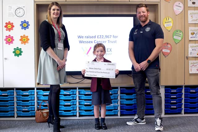 From left: Sarah King from Wessex Cancer Trust, Evelyn, Chris Ayres, one of The Bubbleheads.