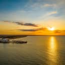 A golden sunrise above South Parade Pier and Southsea. Picture: Marcin Jedrysiak.  Instagram: @drone_photography7777