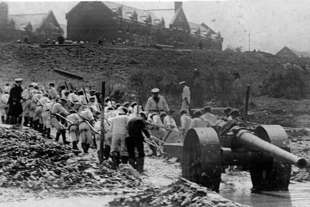 The White Force hauls a gun out of the mud and on to Whale Island during the 'Great War' in June 1904. Picture: costen.co.uk