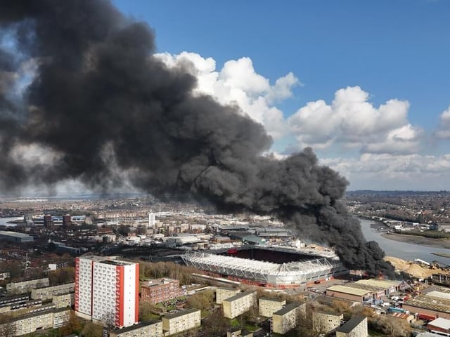 The sky is filled with a plume of smoke outside St Mary's Stadium