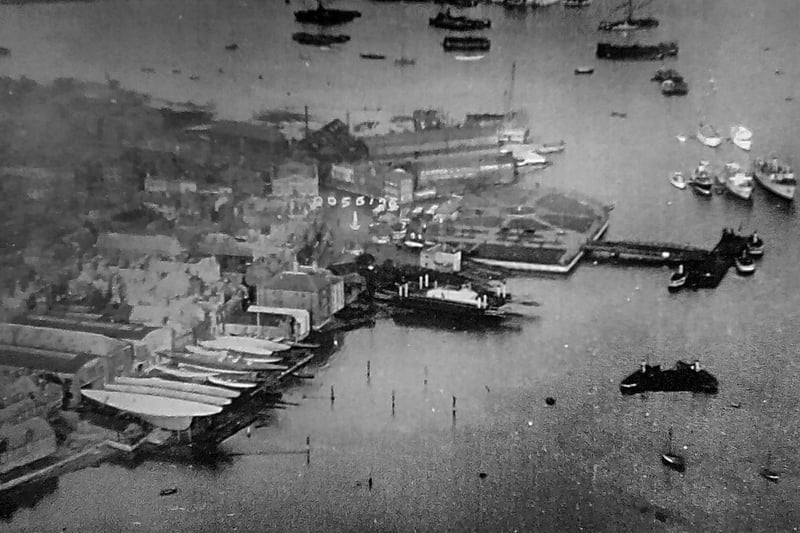 December 1934 aerial photo in Colin M Baxter's archive of the Gosport waterfront. J-class yachts Velsheda and Endeavour among those laid up in Camper and Nicholson's yard at Beach St. The floating bridge, ferry gardens and Camper and Nicholson's building sheds .