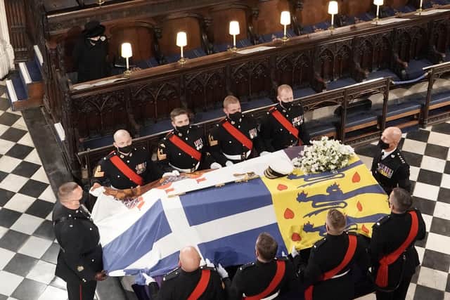 The coffin of Queen Elizabeth II's husband, the Duke of Edinburgh, being placed on the catafalque at St George's Chapel, Windsor Castle, Berkshire, during his funeral service. Picture: Jonathan Brady/PA Wire.