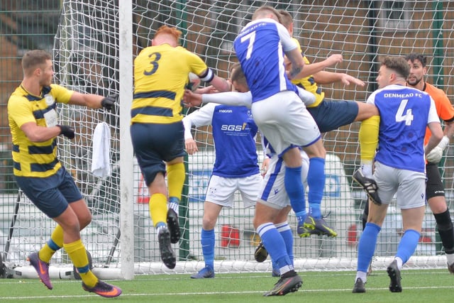 Denmead (blue) defend a corner. Picture by Martyn White