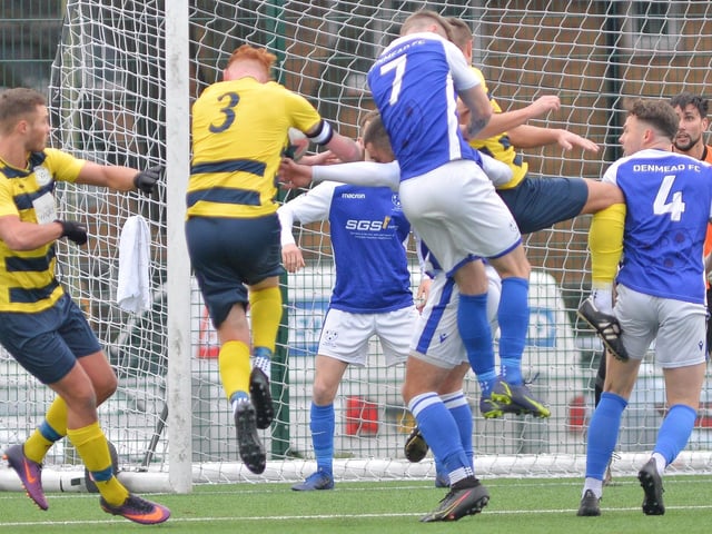Denmead (blue) defend a corner. Picture by Martyn White