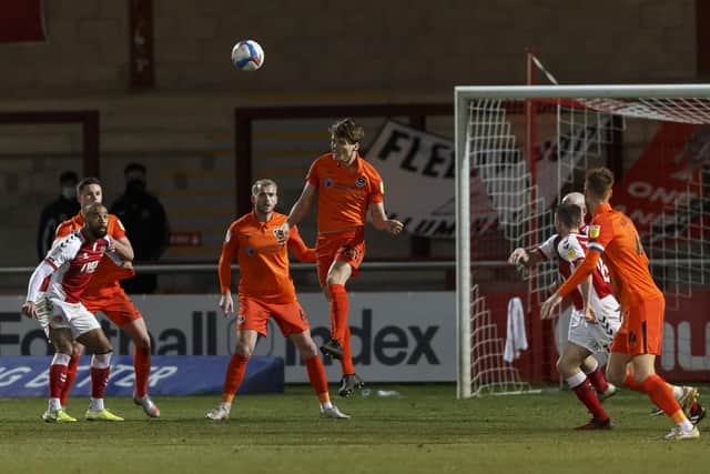Sean Raggett heads the ball clear against Fleetwood as Pompey's defense made it 476 minutes without conceding a League One goal. Picture: Daniel Chesterton/phcimages.com