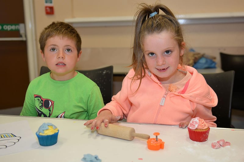 Cousins Tyler Green and Olivia Jeffries during the cake decorating event held in the Central Library in 2015.
