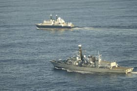 The Royal Navy could starting patrolling Irish waters in a bid to protect critical undersea infrastructure from Russia. Pictured: HMS Somerset flanking Russian ship Yantar near UK waters.