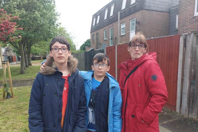 Jack, Ryan and Michelle Godley, residents of block C in Grafton Street, Portsmouth on May 11, 2022