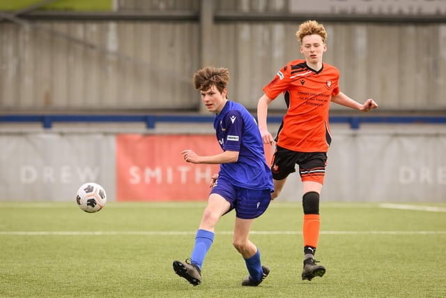 Action from the Portsmouth Youth League Stuart Madigan Cup final between Baffins Milton Rovers Vipers U14s (all blue kit) and AFC Portchester Vikings U14s (orange and black kit). Picture: Keith Woodland (190321-318)
